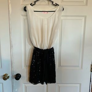 Size M junior dress white top and sequin skirt bottom.